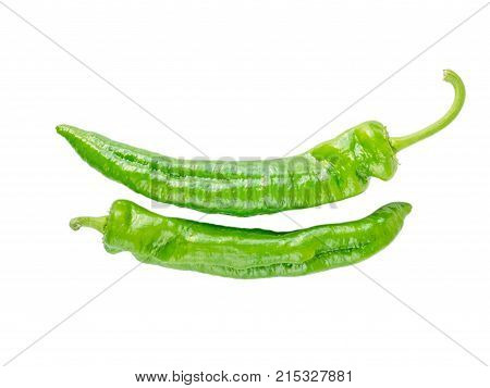 Two green long italian frying peppers isolated on white. Cuban Cubanelle pepper pods.