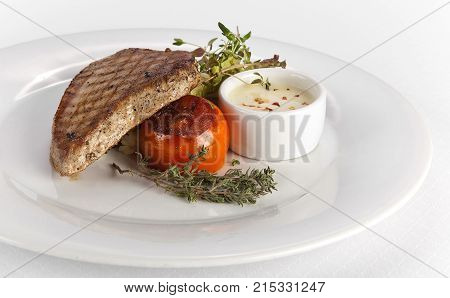 Grilled Tuna Steak with white Sauce on plate