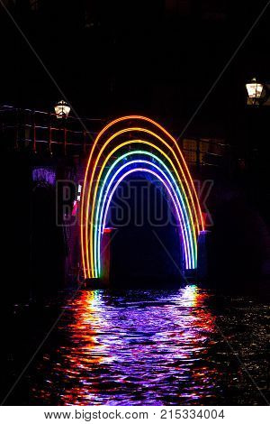 Amsterdam Netherlands - January 14 2017: Illuminated "Bridge of the Rainbow" by night at Amsterdam Light Festival