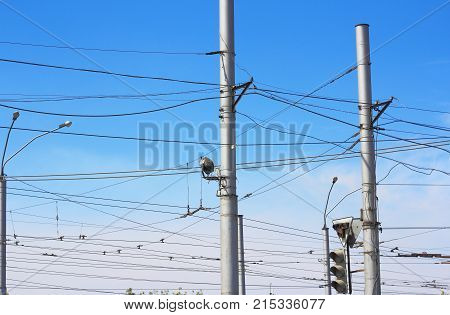 Railroad Railway Catenary Lines Against Clear Blue Sky.