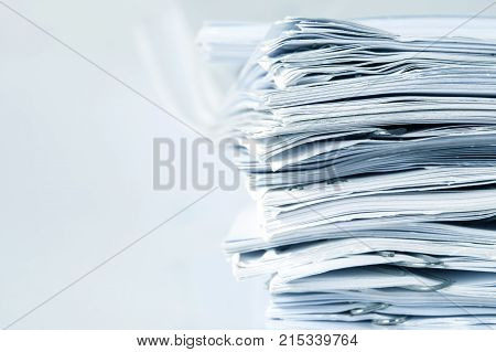 extreamly close up stacking of office working document with paper clip folder