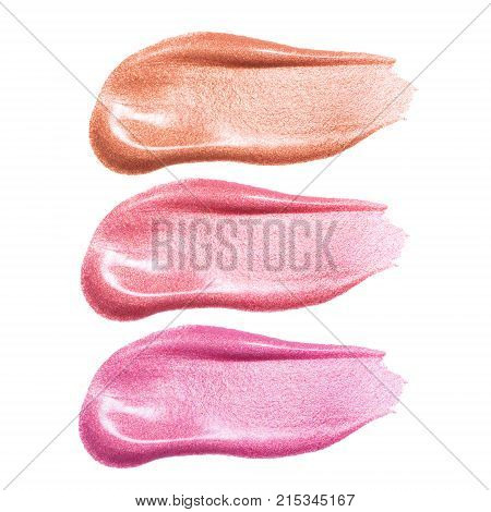 Set of different lip glosses smear samples isolated on white. Smudged makeup product sample