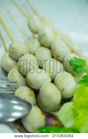 Thai style meatball made from pork stap with spicy sauce and vegetable