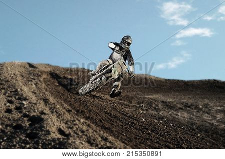 Motocross Rider On Race Track
