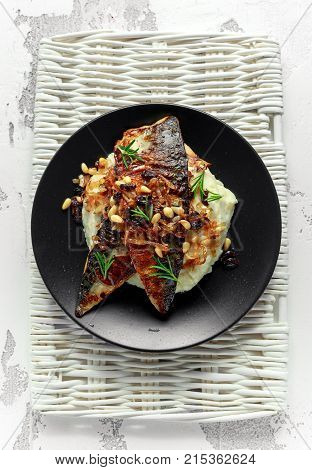 Sicilian style mackerel on cauliflower puree with caramelized onions, pine nuts.