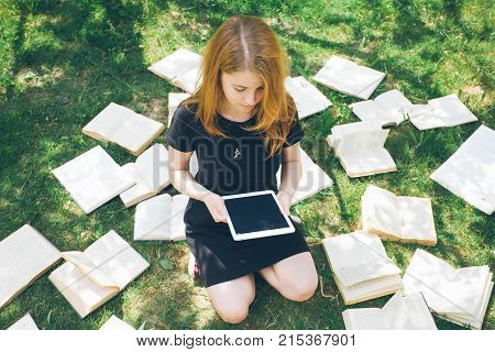Woman Learning With Ebook Reader And Book. Choice Between Modern Educational Technology And Traditio