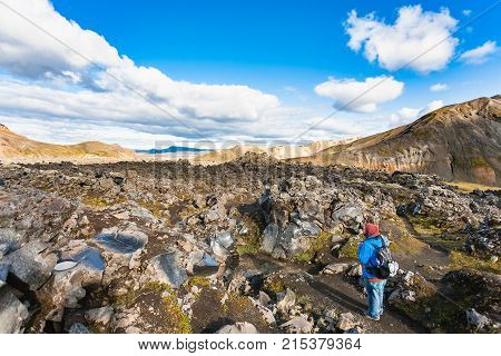 Tourist At Laugahraun Lava Field In Iceland
