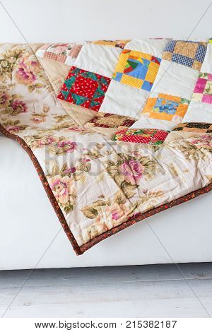 neat loud-coloured covering with pattern from abstract images and outstanding prints of red roses and white chamomile