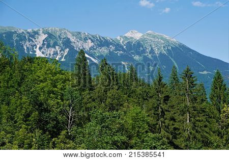View from Vintgar Gorge Slovenia over forest to Mezakla peaks