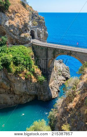 famous picturesque viaduct and winding road over sea of Amalfi coast, Italy