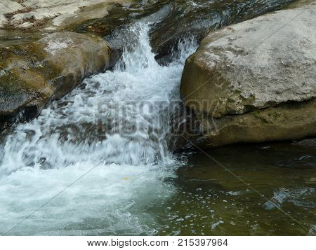 Waterfalls in the mountains of the North Caucasus surrounded by beautiful autumn nature