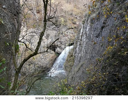 Waterfalls in the mountains of the North Caucasus surrounded by beautiful autumn nature