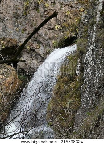 Waterfalls in the mountains of the North Caucasus surrounded by beautiful autumn nature
