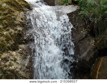 Waterfalls in the mountains of the North Caucasus surrounded by beautiful autumn nature