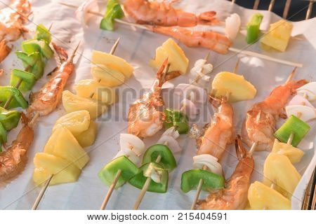 Homemade Skewer With Delicious Grilled Shrimps On Parchment Paper