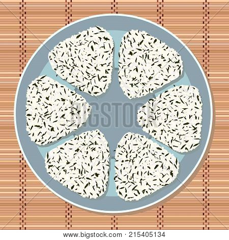 Japanese sticky rice ball with wakame seaweed pieces. Lunch theme. Japanese cuisine. Lunch Illustration. Asian snack plate on the japanese bamboo mat.