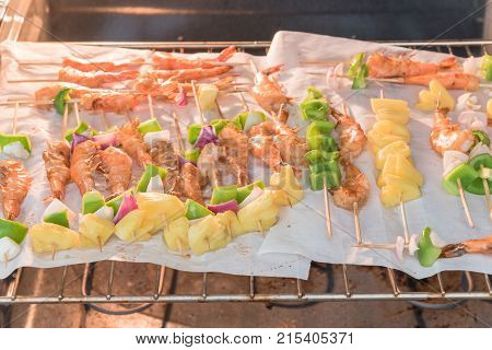 Homemade Skewer With Delicious Grilled Shrimps On Parchment Paper
