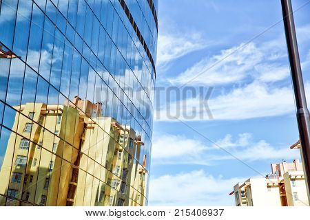 Building glass . Crosswalk photo over the highway Modern business architecture with reflection in glass windows