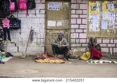 ADDIS ABABA, ETHIOPIA-OCTOBER 25, 2017: Unidentified street sellers sell fruits and peppers in the capital of Ethiopia, Addis Ababa.