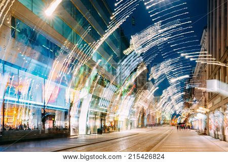 Helsinki, Finland. Abstract Background Of Night View Of Aleksanterinkatu Street In Kluuvi District In Evening Christmas Xmas New Year Festive Illumination.