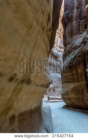 The Siq of Petra shows unique colorful rock formations in the nabatean city of Petra in Jordan