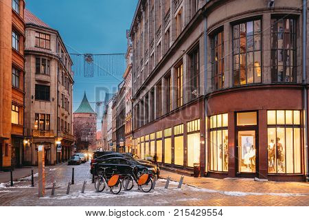 Riga, Latvia. Shop And Powder Tower On Valnu Street In Winter Evening.