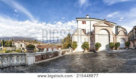 View from old terrace to bridge Ponte degli Alpini and mountain in Bassano del Grappa in Italy