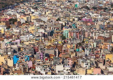 Aerial view on chaos of colored buildings - the heap of houses in the Asian cities caused by big human overpopulation.