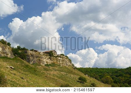 The old buildings above the natural boundary of Mariam Dere near Bakhchisarai. 