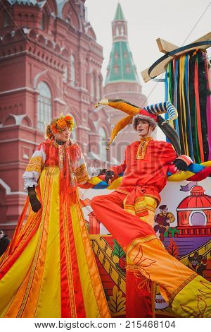 Russia. Moscow.Red square 26 Feb 2017. Carnival Maslenica . skomoroh crowd of people on the background of the Kremlin