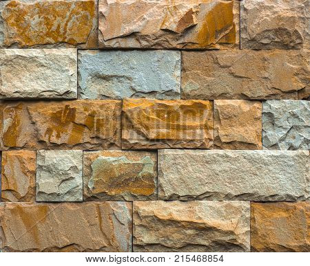 Stone wall texture, travertine tiles facing stone background