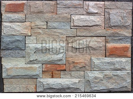 Stone wall texture, travertine tiles facing stone background