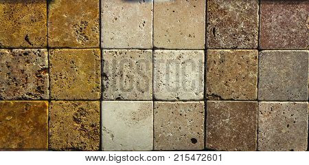 Stone wall texture, travertine tiles facing stone background