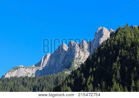 The view of green forest mountains and blue sky.