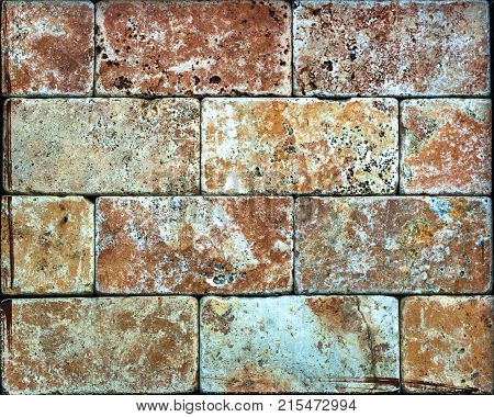 Stone wall texture, travertine tiles facing stone background