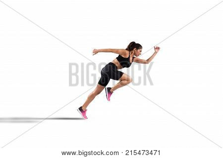 Athletic woman runner in sportswear on the asphalt of a road isolated on white background