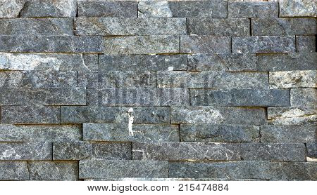 Stone wall texture, travertine tiles facing stone background