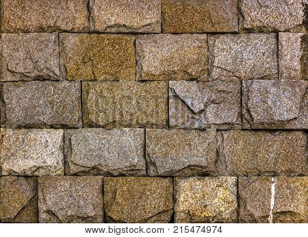 Stone wall texture, travertine tiles facing stone background