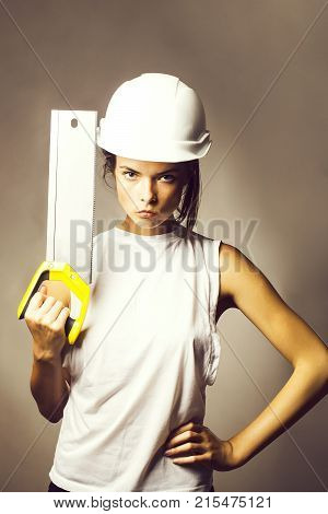 Young Pretty Girl Holding Saw