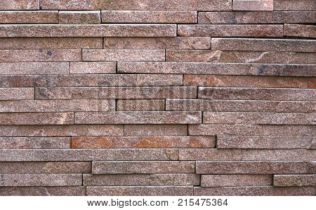 Stone wall texture, travertine tiles facing stone background