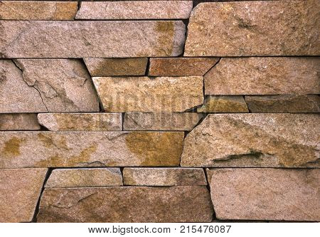 Stone wall texture, travertine tiles facing stone background