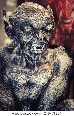ROME, ITALY. October 3, 2015: Evil Lucifer monster during the event Romics 2015 in Rome in Italy. Halloween party creature. A monstrous demonic character. Scary monster.
