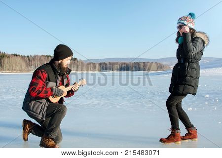Man Playing Ukelele For His Girlfriend