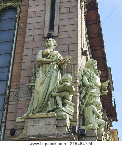 St. Petersburg Russia - May 27 2017: Sculpture on the facade of the theater of comedy. Former store of the Eliseev brothers in St. Petersburg Russia