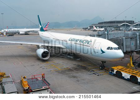 HONG KONG - November 12, 2017: Planes undergo preflight service in the Hong Kong International Airport with American Airline and Cathay Pacific Airlines in background.