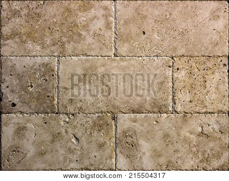 Facing tile from travertine with a smooth surface texture