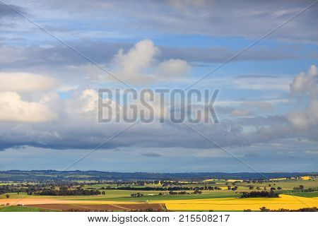 Spring Skies Over Rural Farms And Crops