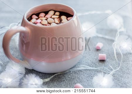 Hot Chocolate  Pink Ceramic Mug Marshmallows And Garland  Gray Knitted Background