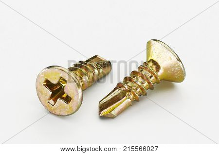 self tapping metal screw with hex head on a white background
