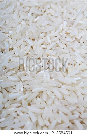 Rice background. Rice texture basmati long pattern, white raw uncooked rice closeup. Raw rice.